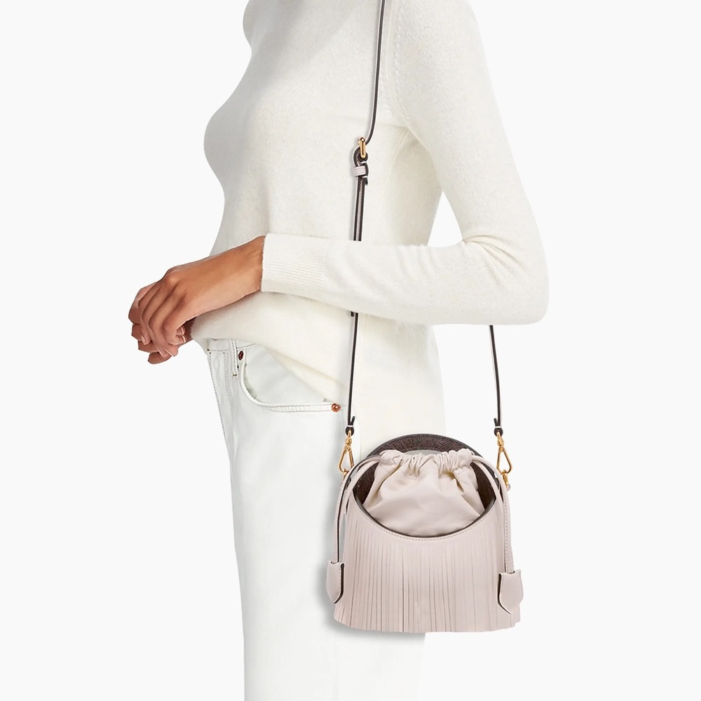 Etro Saturno Runway fringed leather bucket bag in a light pink/beige color